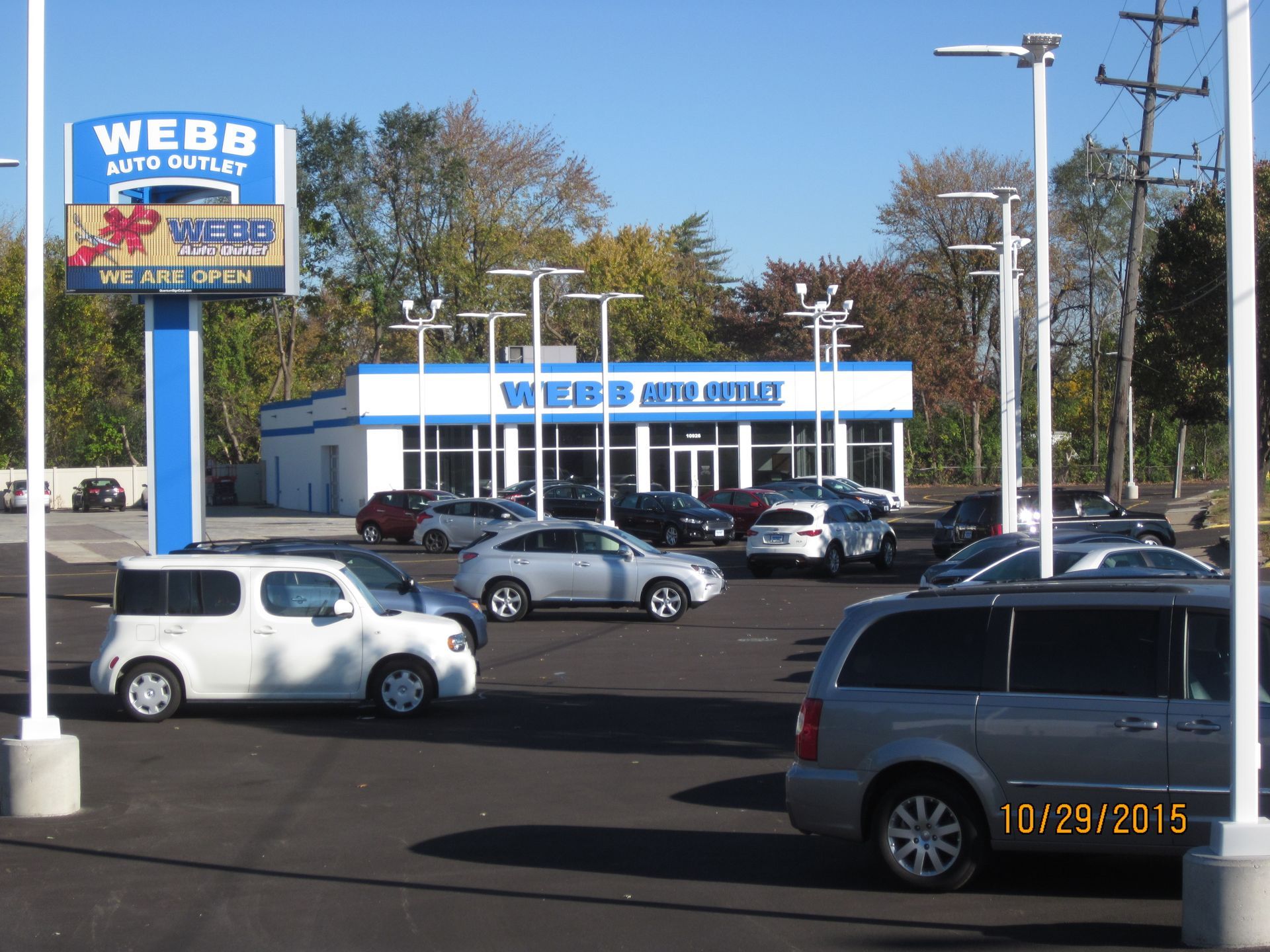 A kitchen with dark cabinets and a skylight