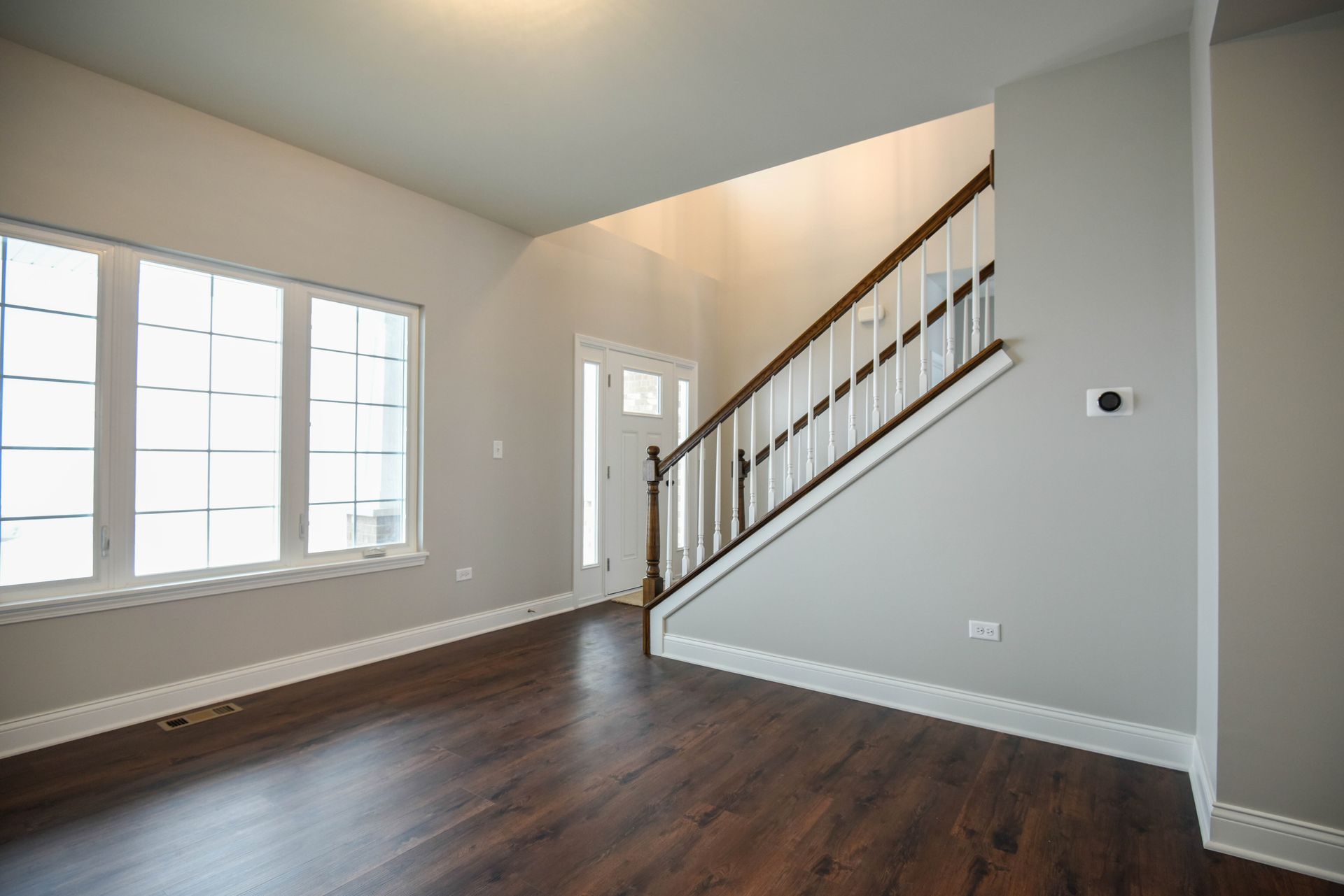 A staircase with a white railing and wooden steps