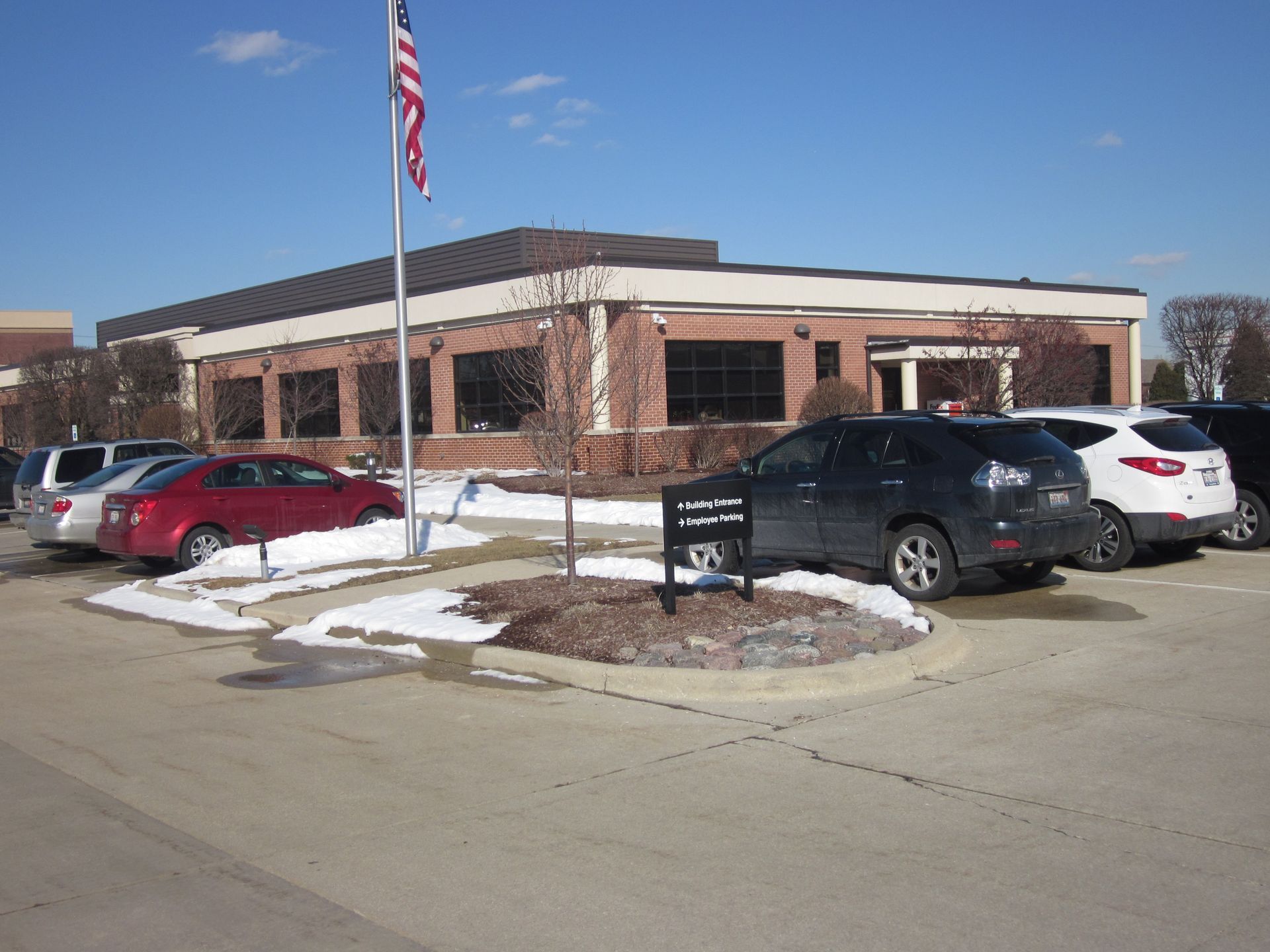 A bedroom with a bed, nightstands, and a ceiling fan.