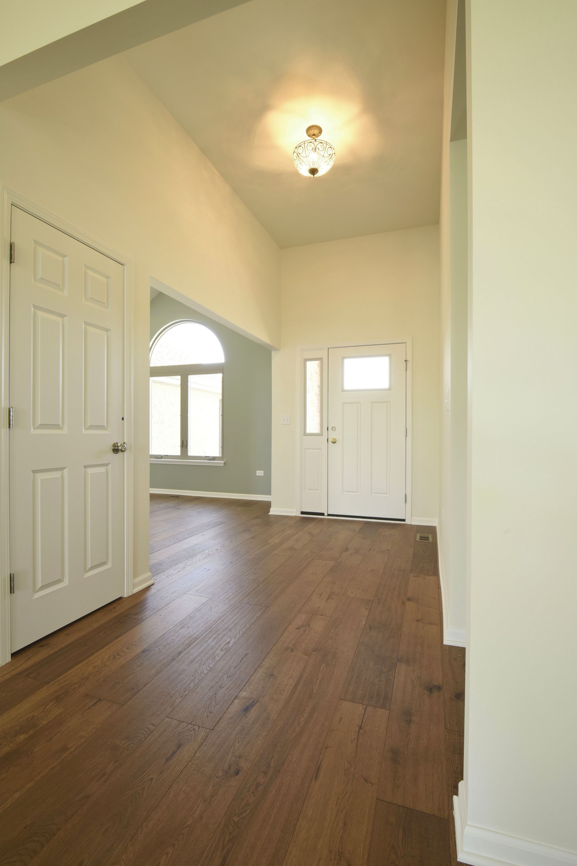 A bathroom with a toilet, sink and mirror