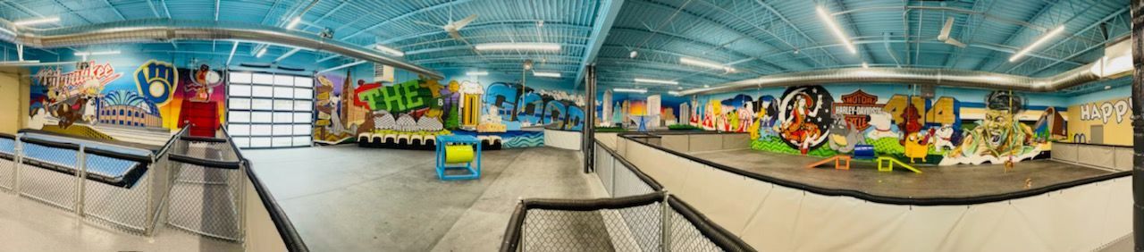 A panoramic view of a shopping mall with a blurred background