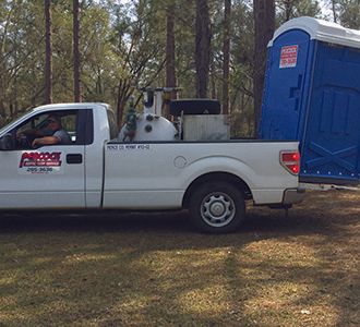 Truck carrying Portable toilet