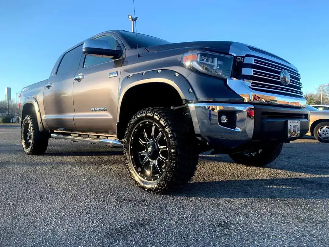 A toyota tundra is parked in a parking lot.