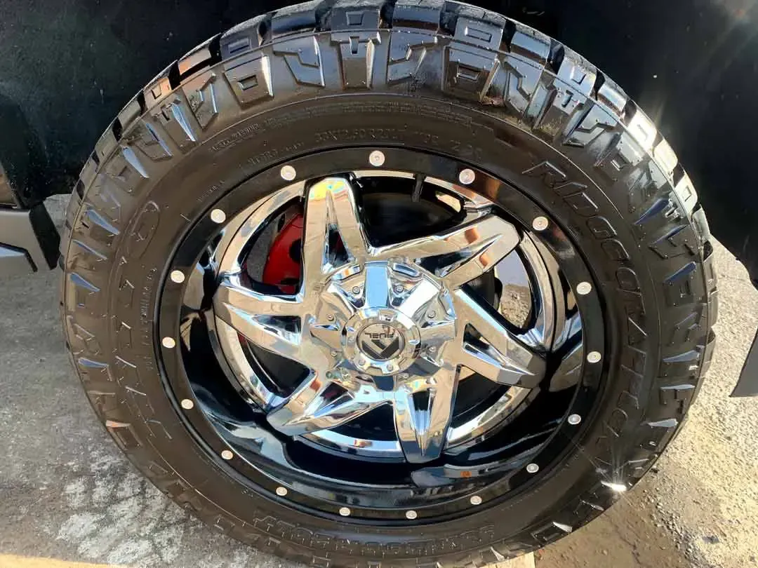 A close up of a tire and wheel on a truck.