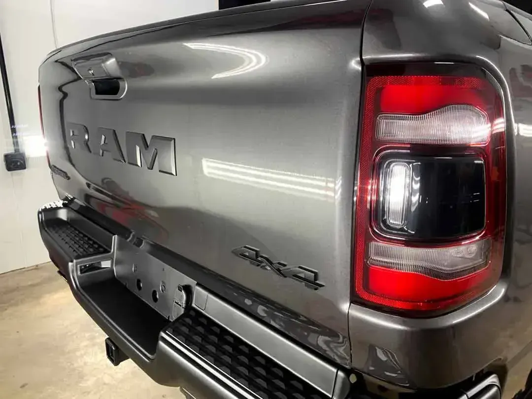 The back end of a silver ram truck is shown.