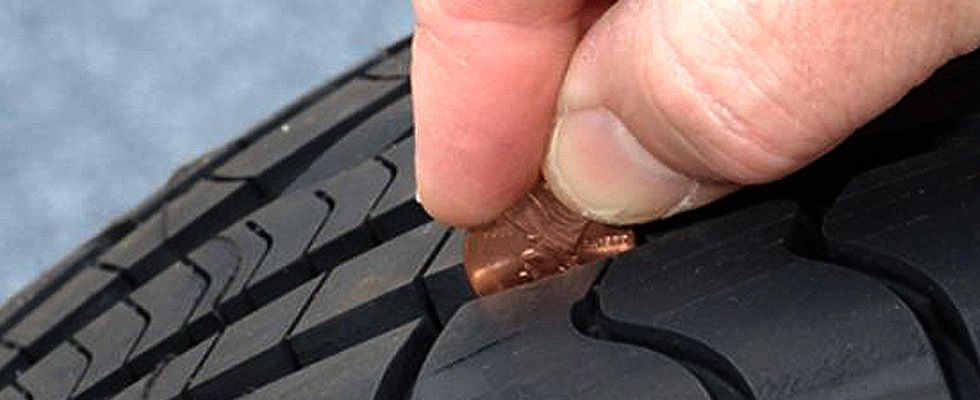 Coin on truck tire tread