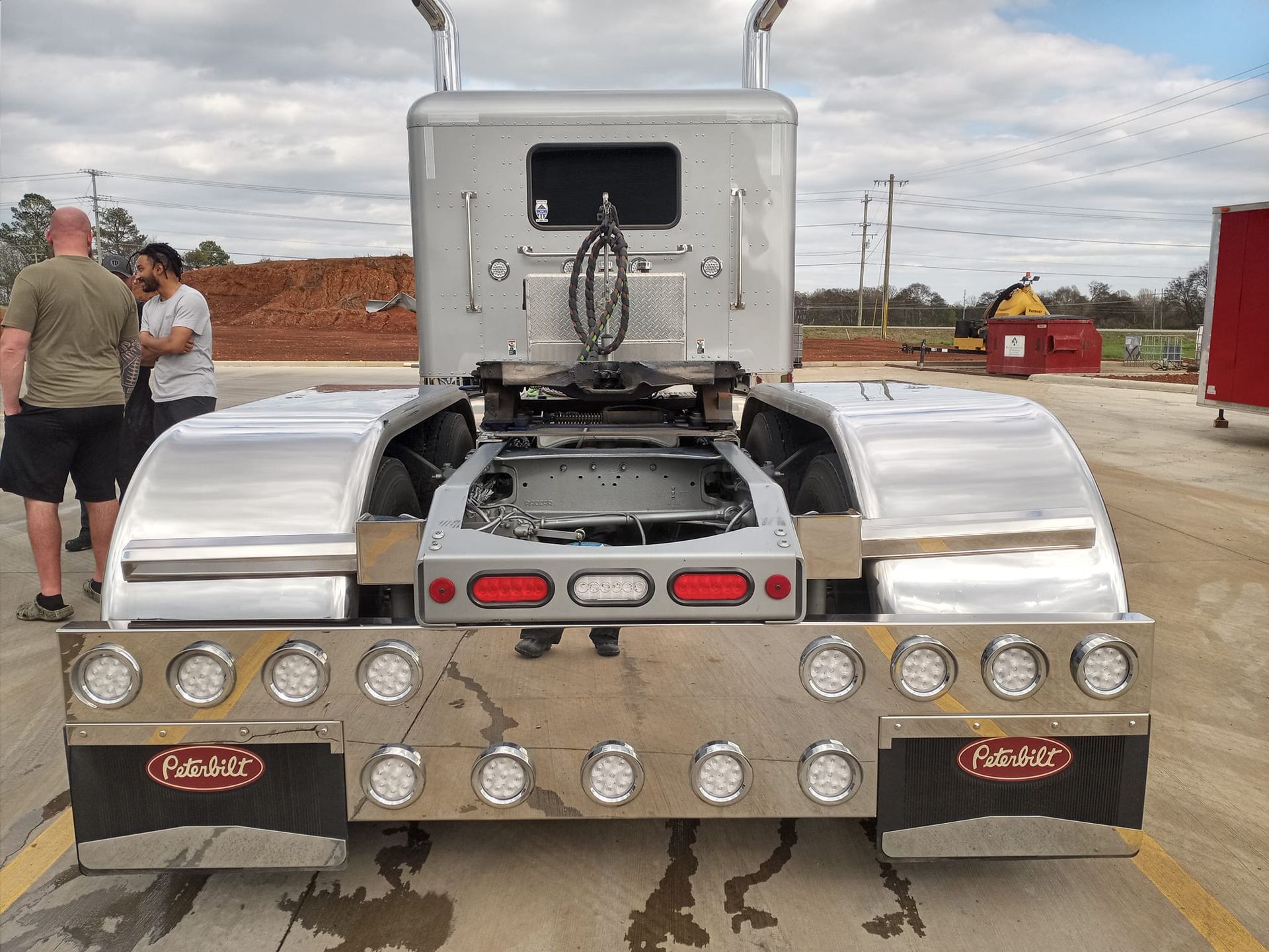 a peterbilt semi truck is parked in a parking lot