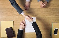 A group of people are shaking hands