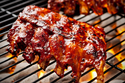 Ribs on a grill over flames