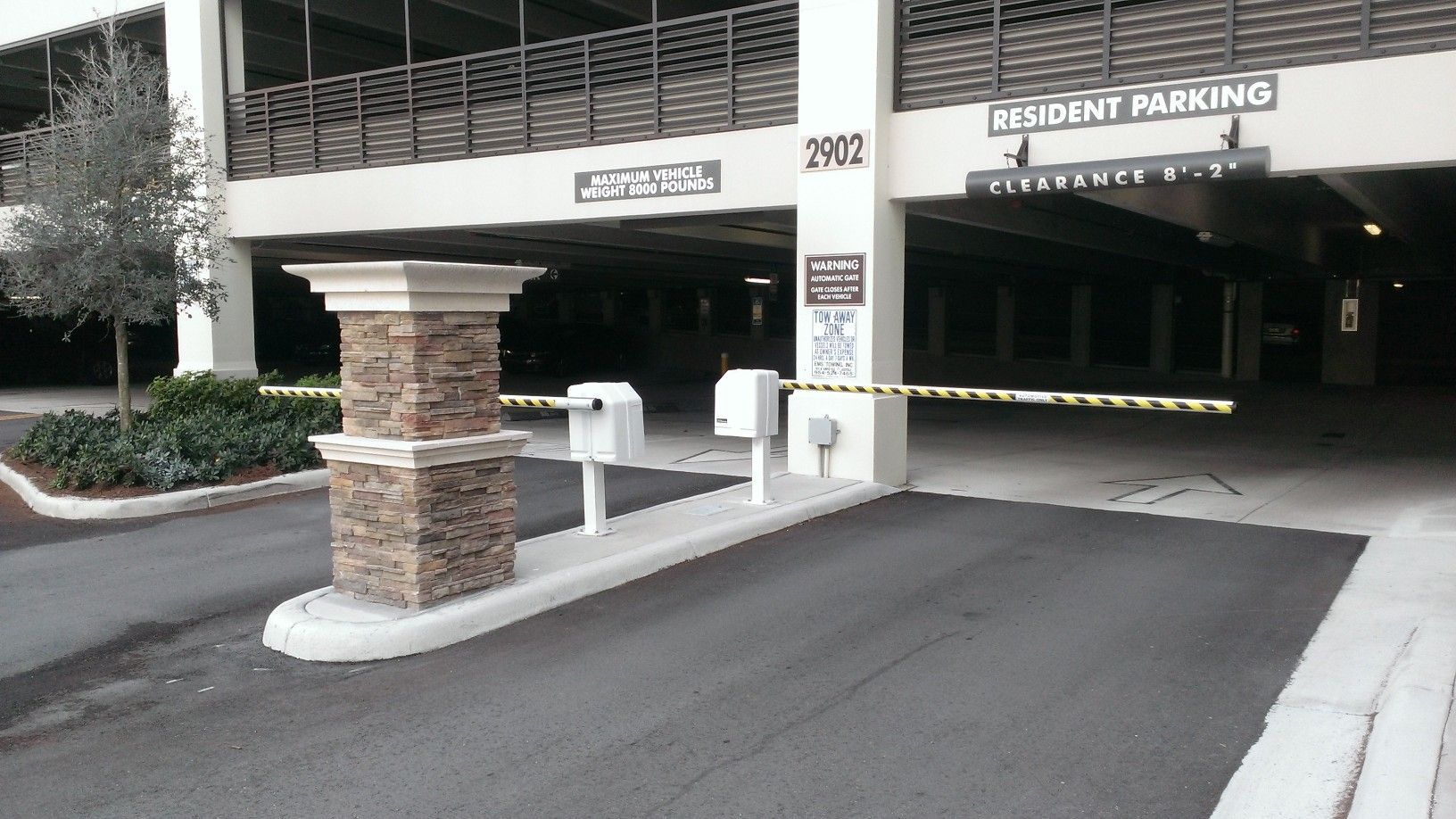 a parking garage with a sign that says resident parking