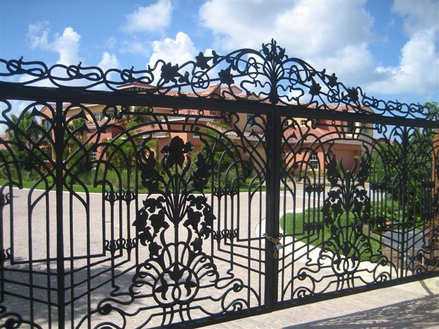 a wrought iron gate with a floral design on it