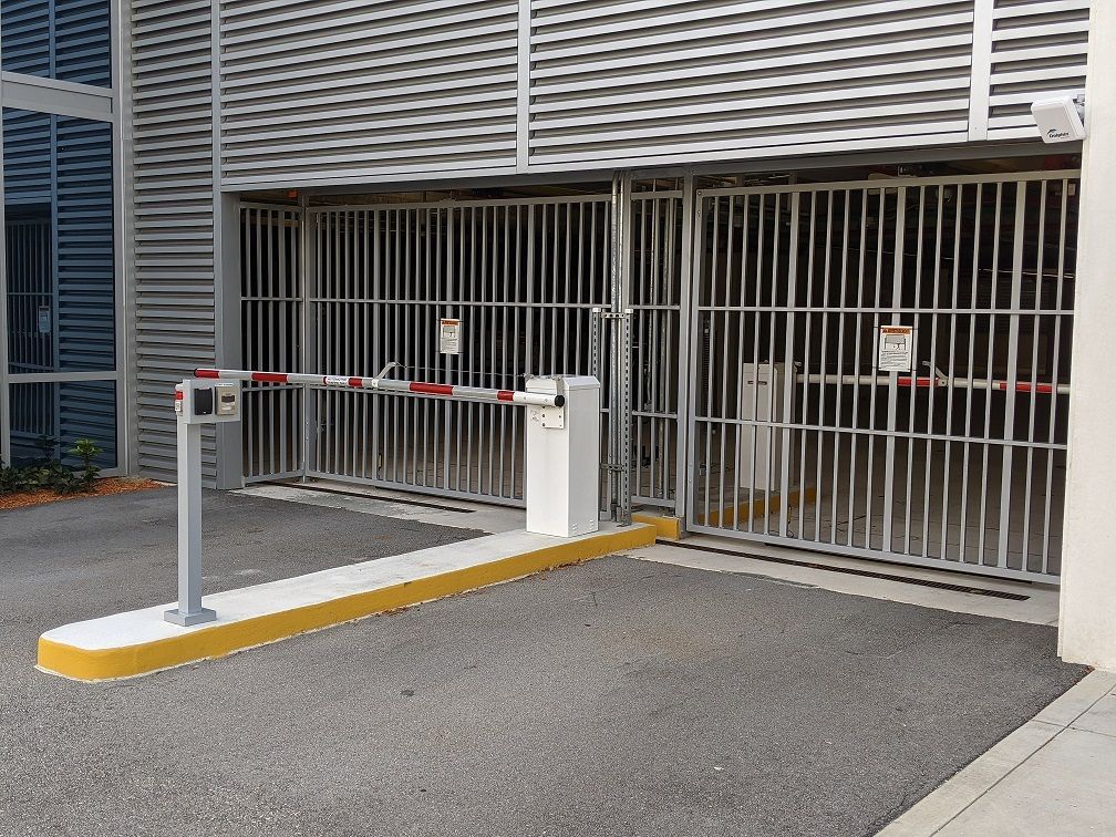 a parking garage with a barrier in front of it .
