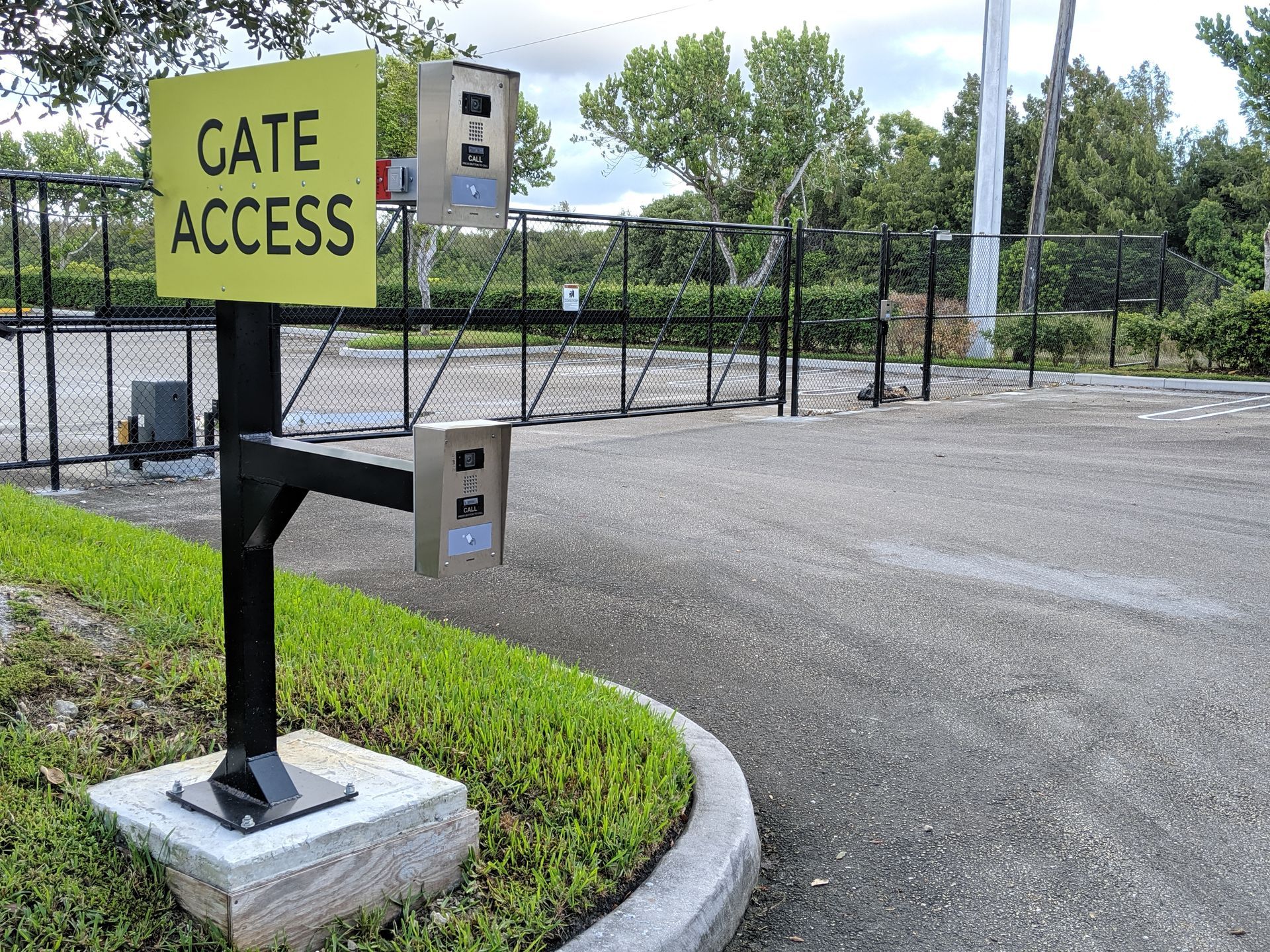 a yellow sign that says gate access on it