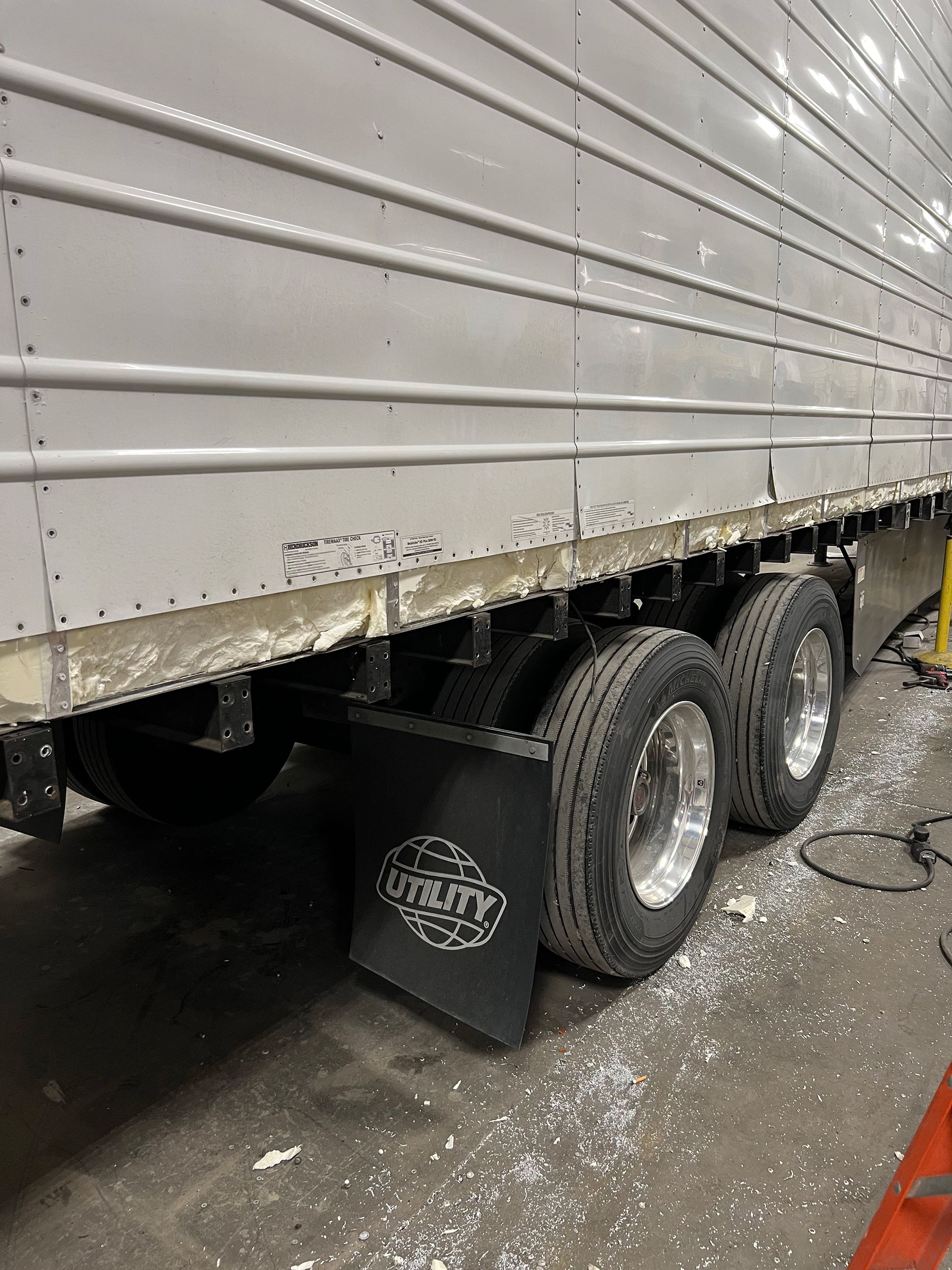 Side view of a damaged reefer container