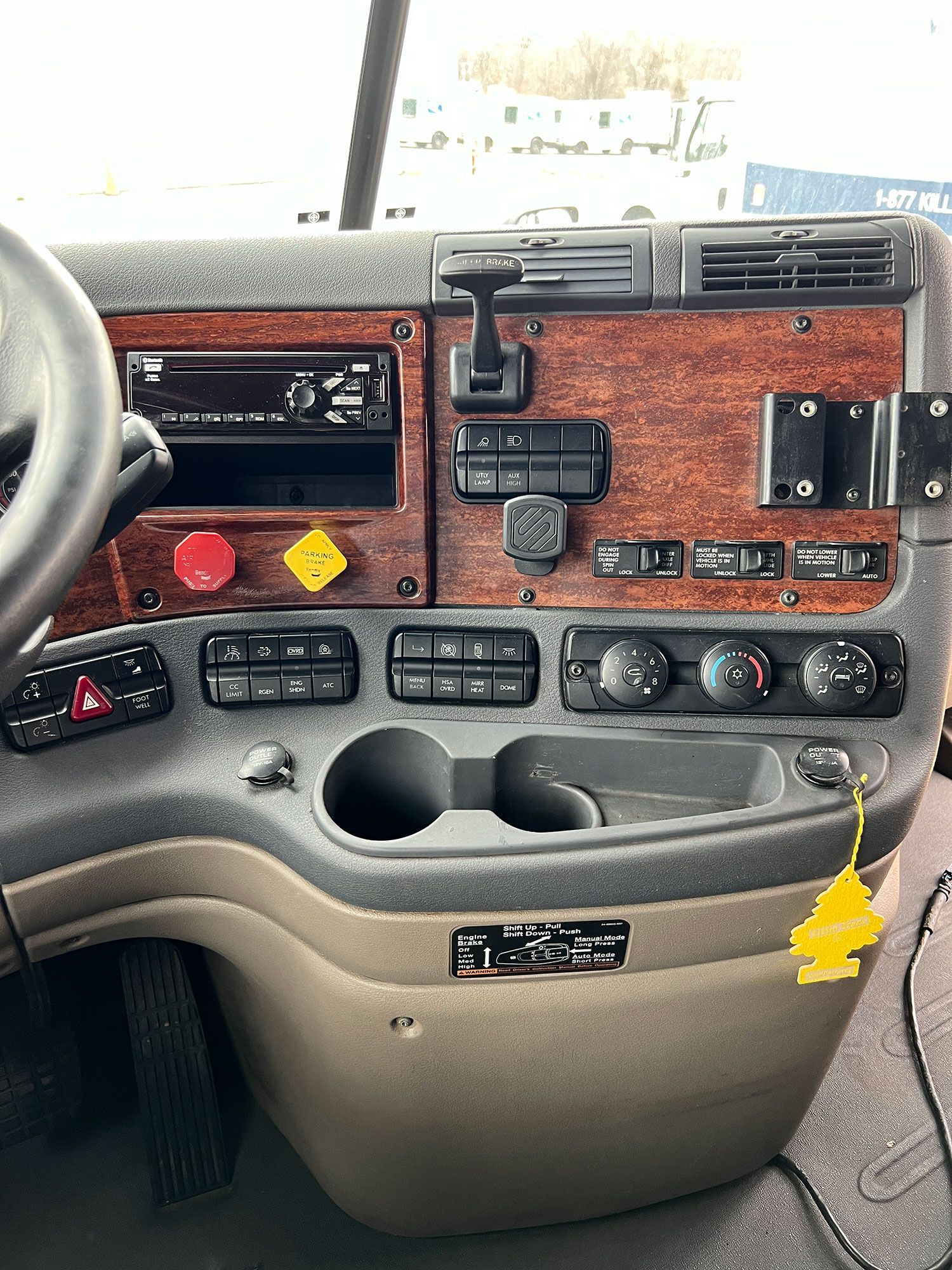 A close up of the dashboard of a semi truck