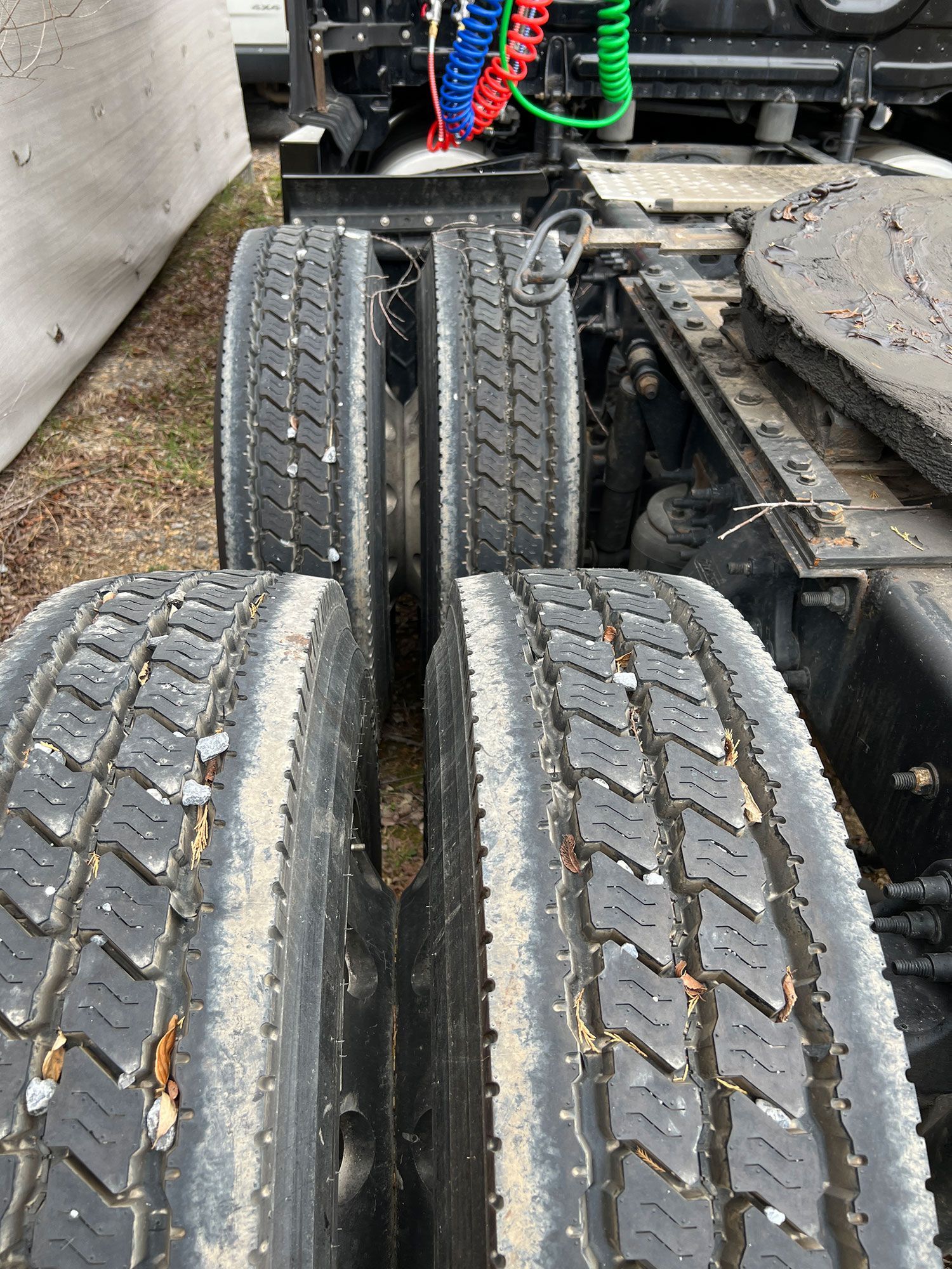 A close up of two tires on a semi truck