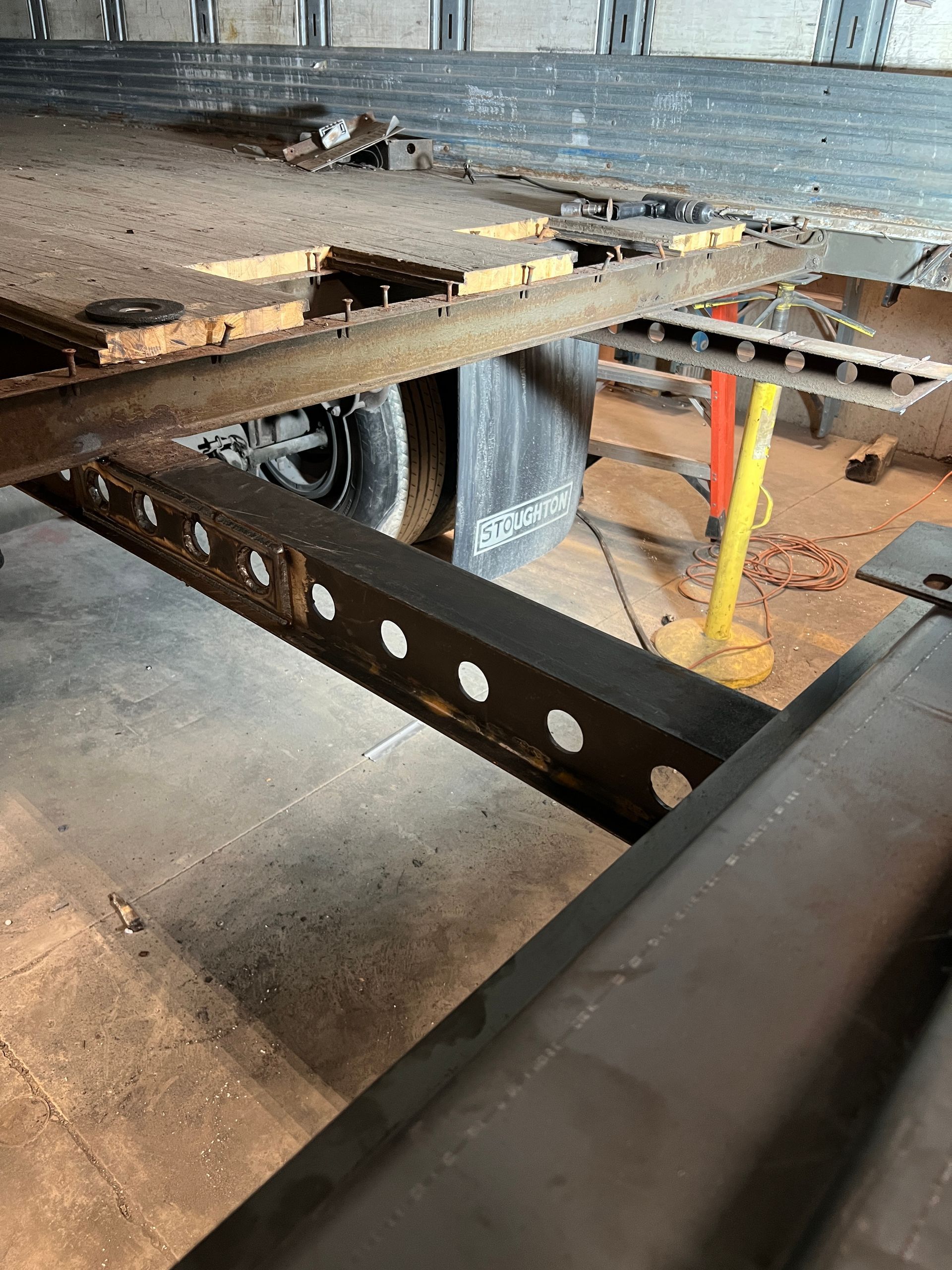 A close up of a metal structure in a building under construction.