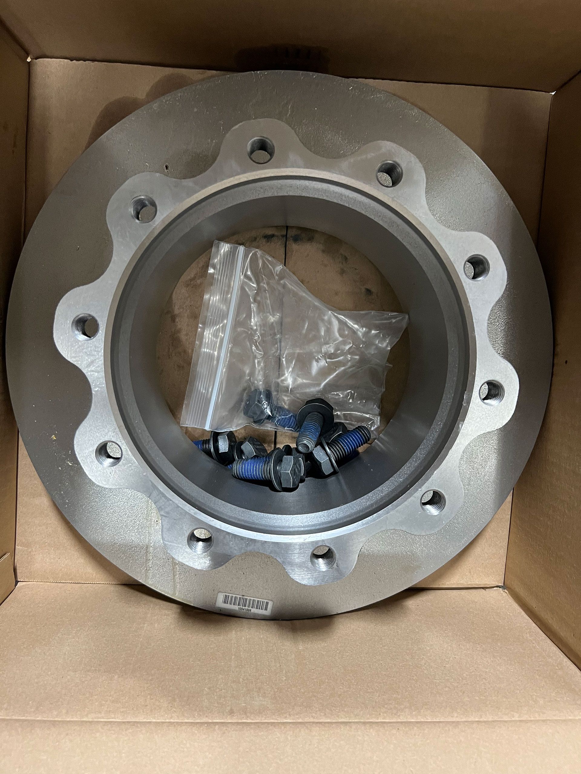 A close up of a brake disc in a box