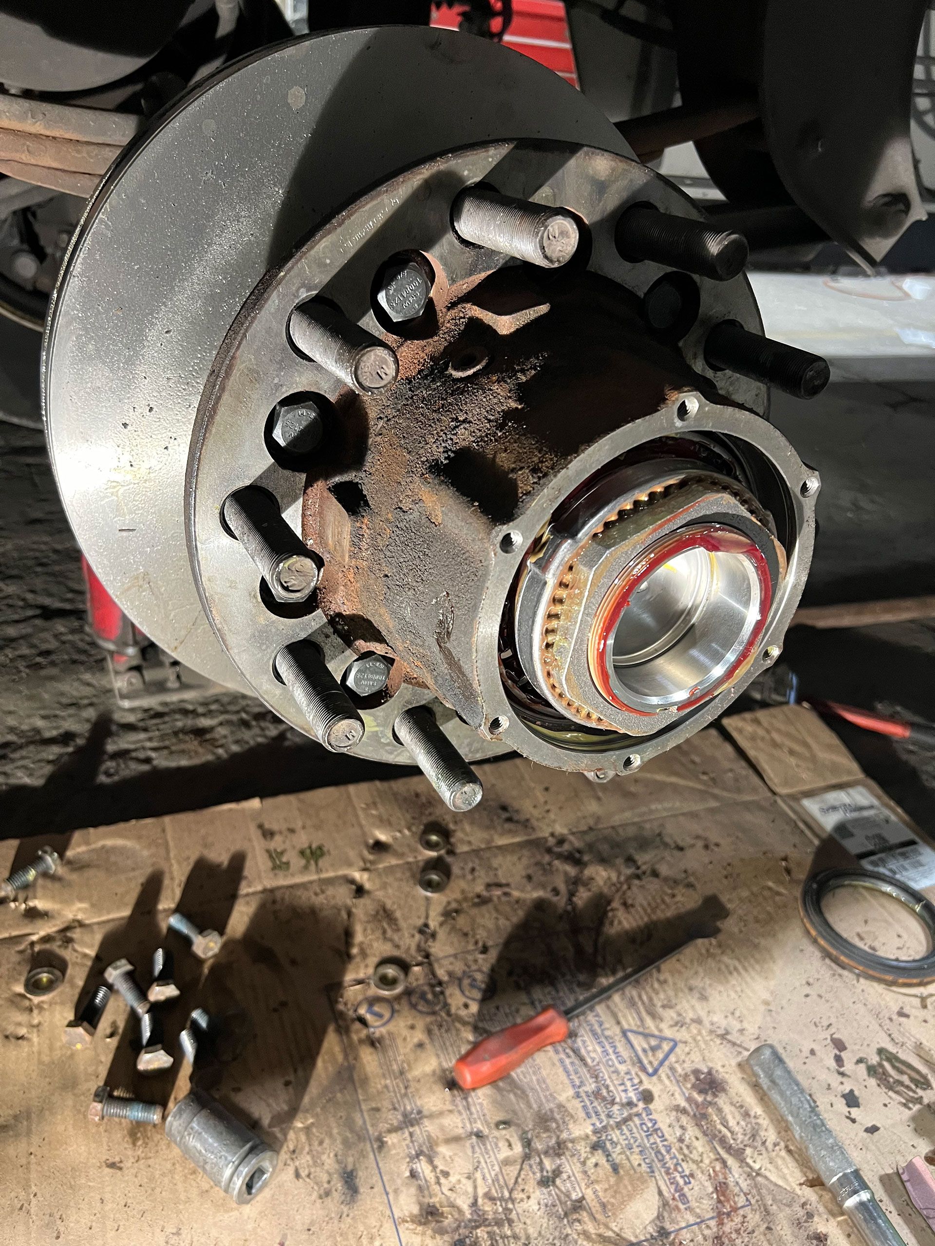 A brake disc is being removed from a vehicle