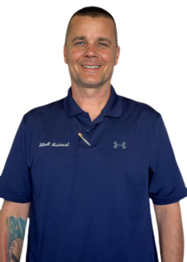 Man smiling, wearing a blue polo shirt with a pen in the collar, and a tattoo on his left arm.