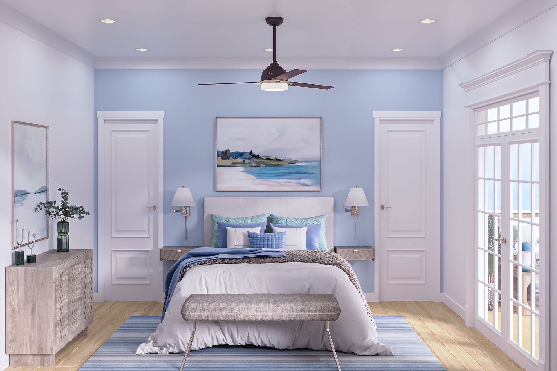 A bedroom with a bed, dresser, mirror, and ceiling fan.