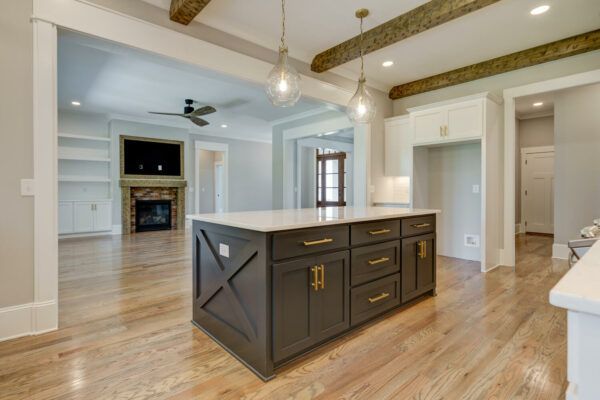 A kitchen with a large island in the middle of the room.