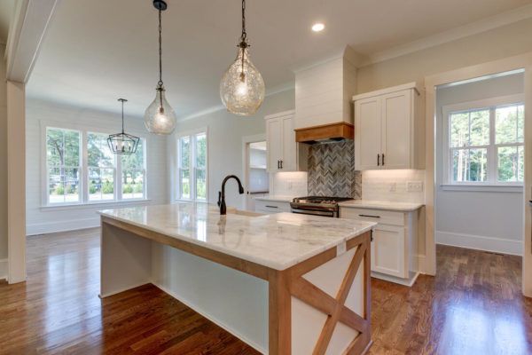 A kitchen with a large island in the middle of the room.
