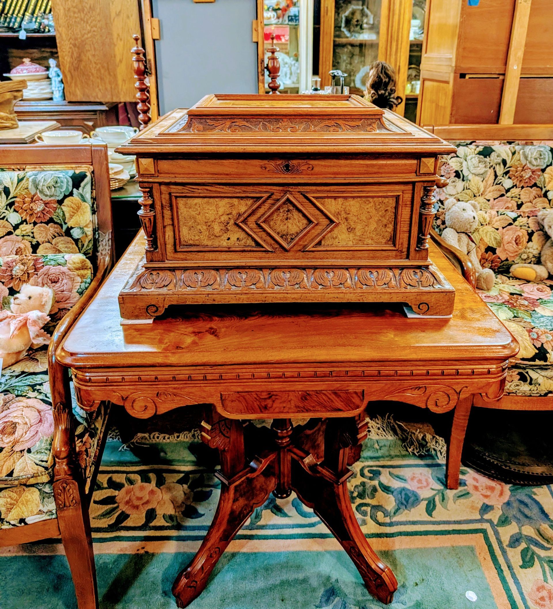 A wooden box is sitting on top of a wooden table.