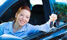 Woman holding auto key