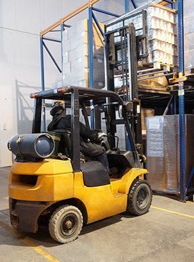 Working yellow fork lift