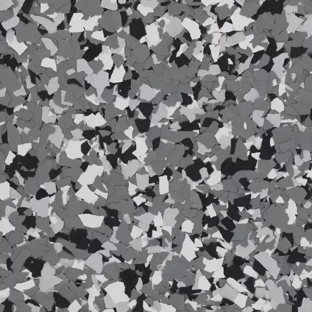 Abstract grayscale mosaic of small irregular shapes filling the frame.