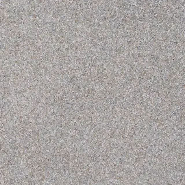 Close-up of a gray speckled texture, resembling carpet or stone.