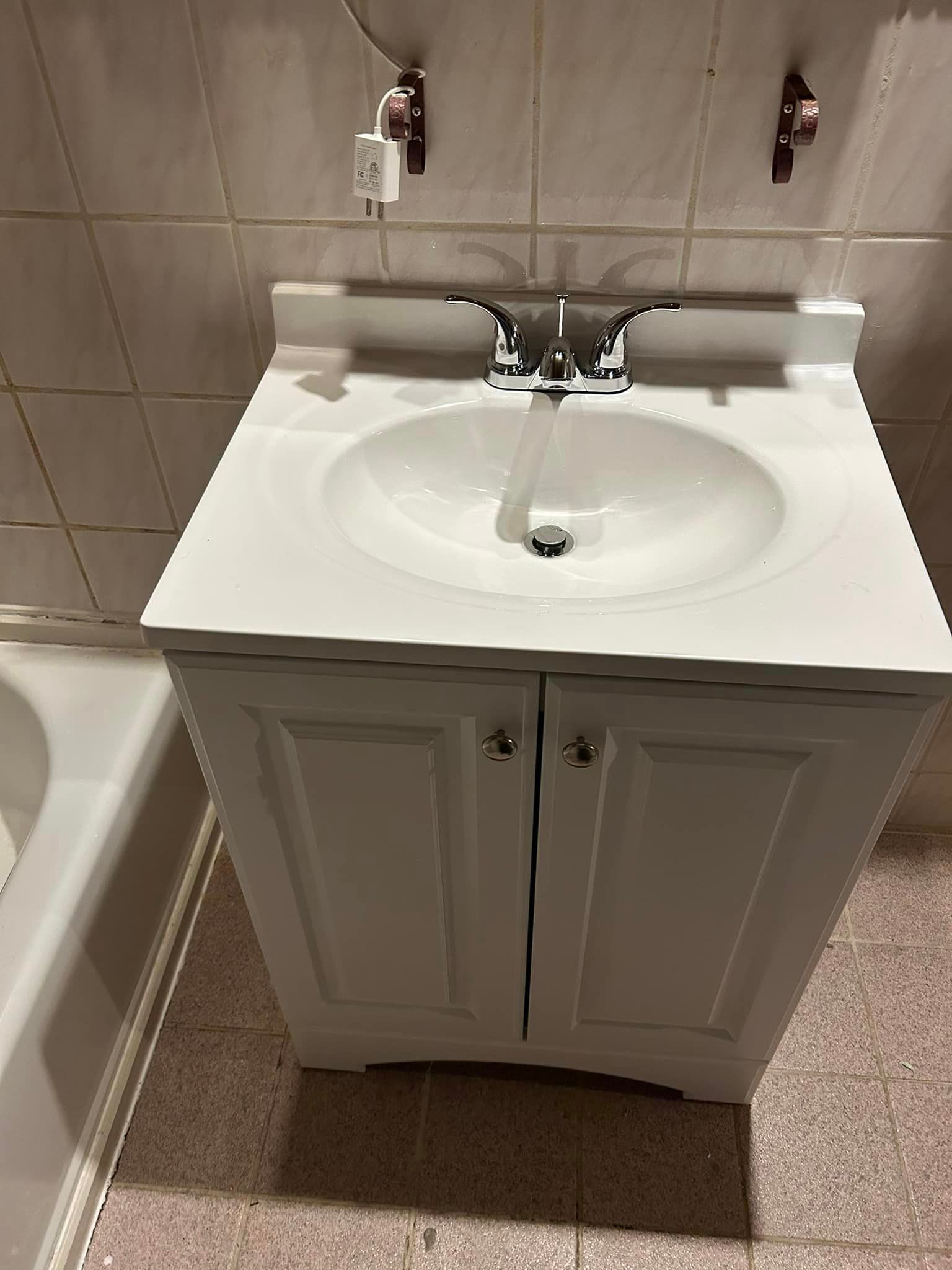 a bathroom with a sink and a bathtub .