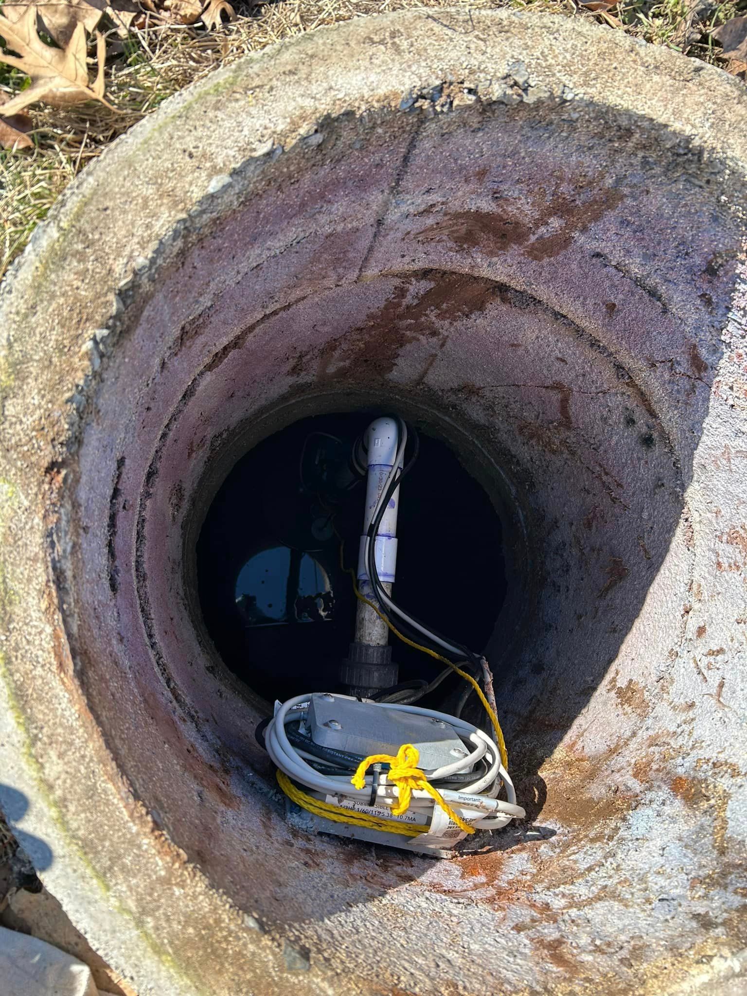 a manhole cover with a pump inside of it .