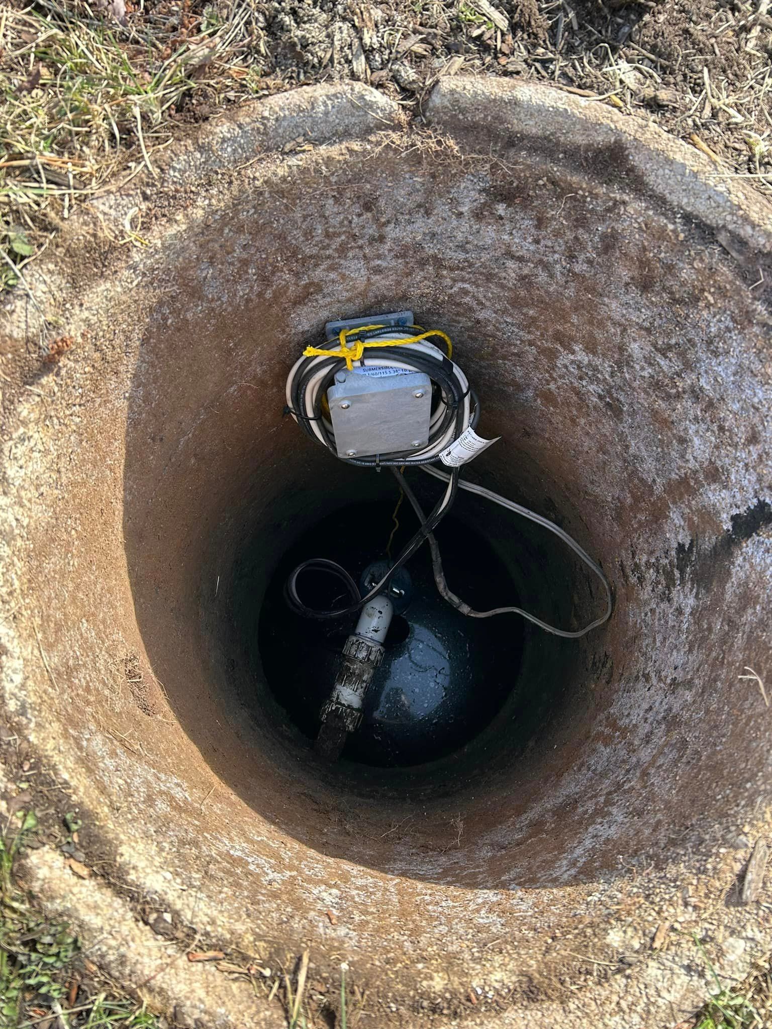 a device is sitting in the middle of a hole in the ground .