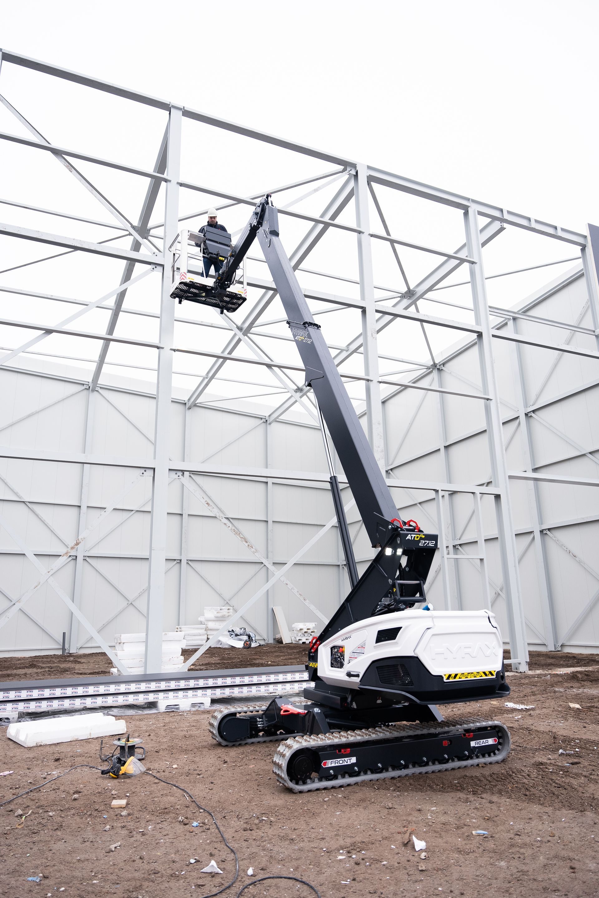 A crane is being used to build a building on a construction site.