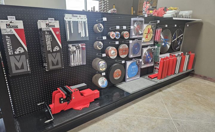 A store display of tools including a red vise