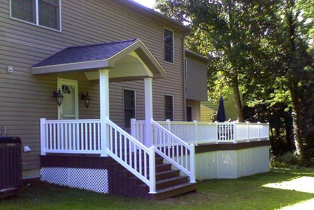 A house with a porch and stairs leading up to it
