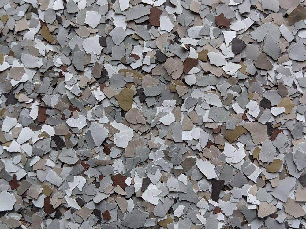 Close-up of a pile of small gray, white, and tan gravel pieces