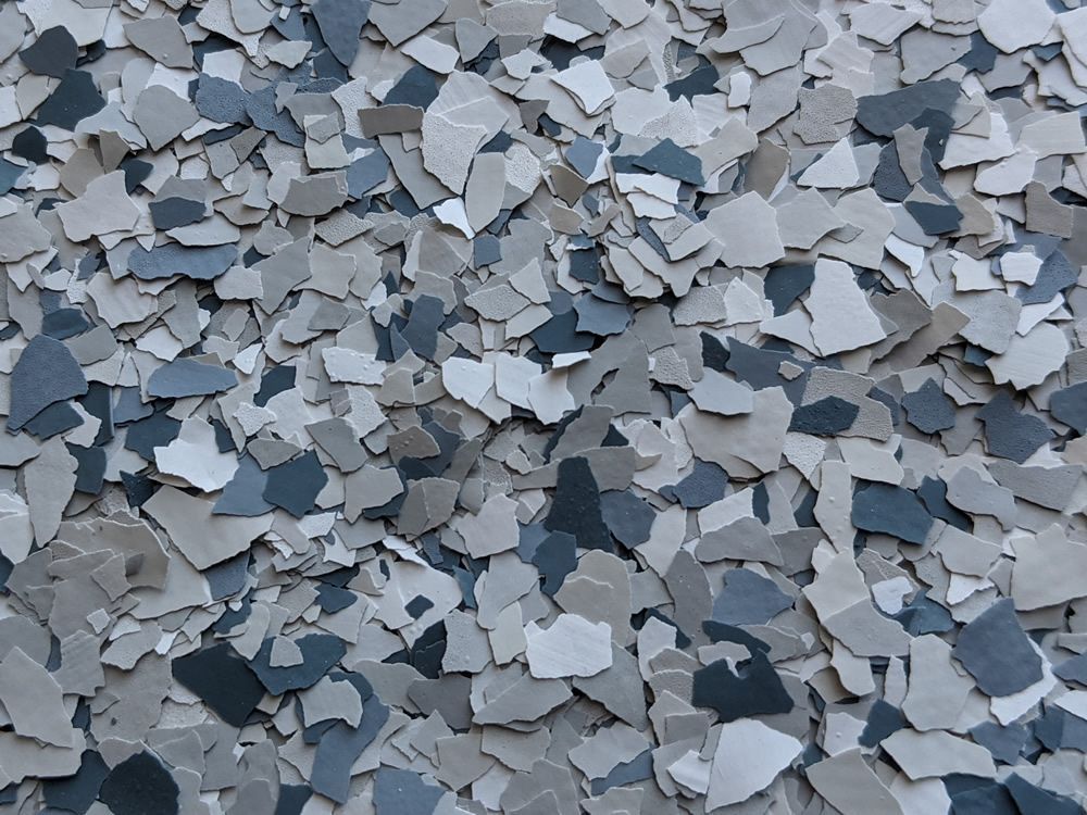 Pile of irregular gray and blue crushed stone chips covering the frame
