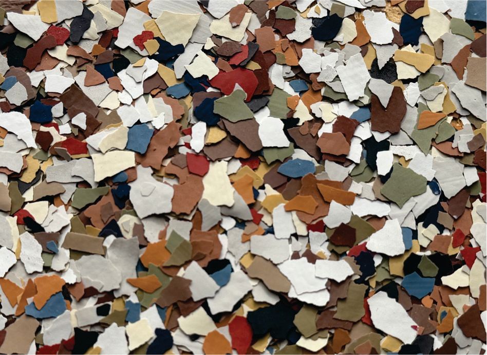 Scattered multicolored wood chips and debris filling the frame
