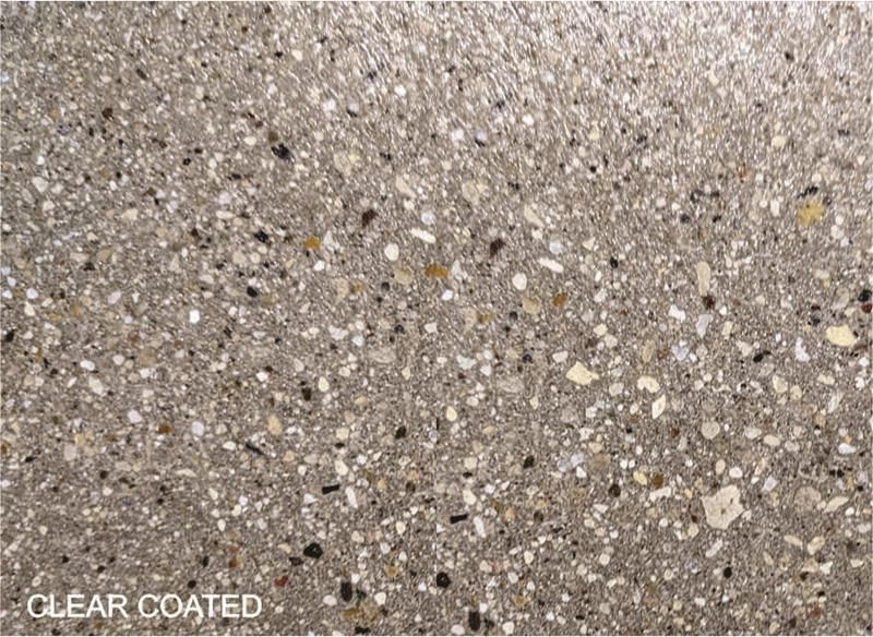 Speckled beige and gray textured surface with “CLEAR COATED” text in the corner