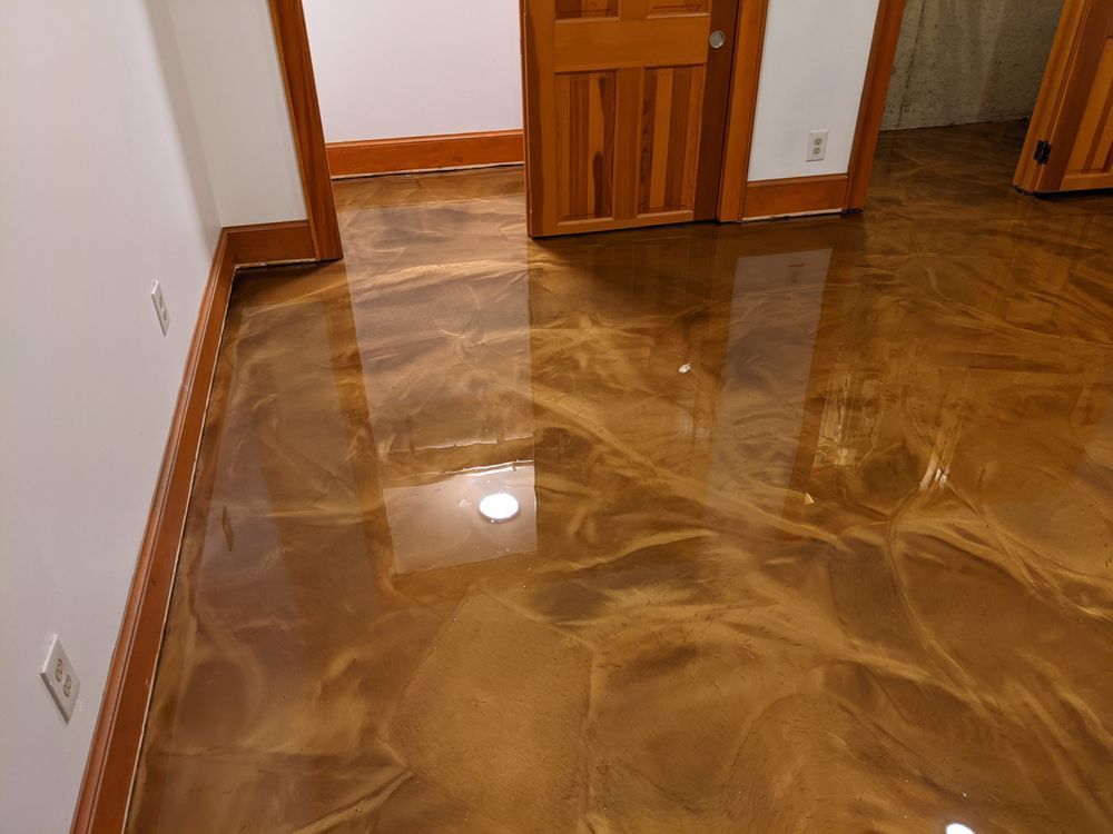 Shiny brown polished floor in an empty hallway with wooden doorways and white walls