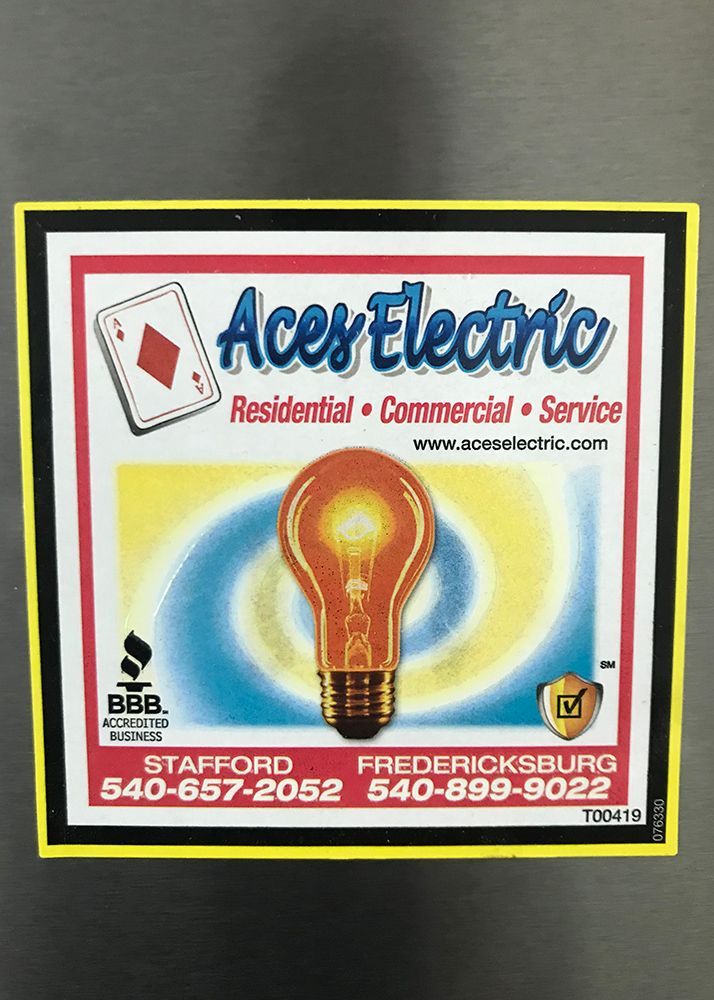 Aces Electric advertisement with lightbulb and playing card, contact info, and service details.