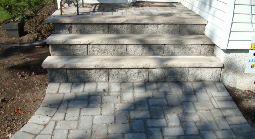Stone steps and walkway leading to a house entrance.