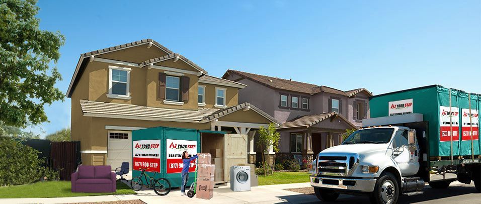 Moving truck and crew outside a suburban house during a home move