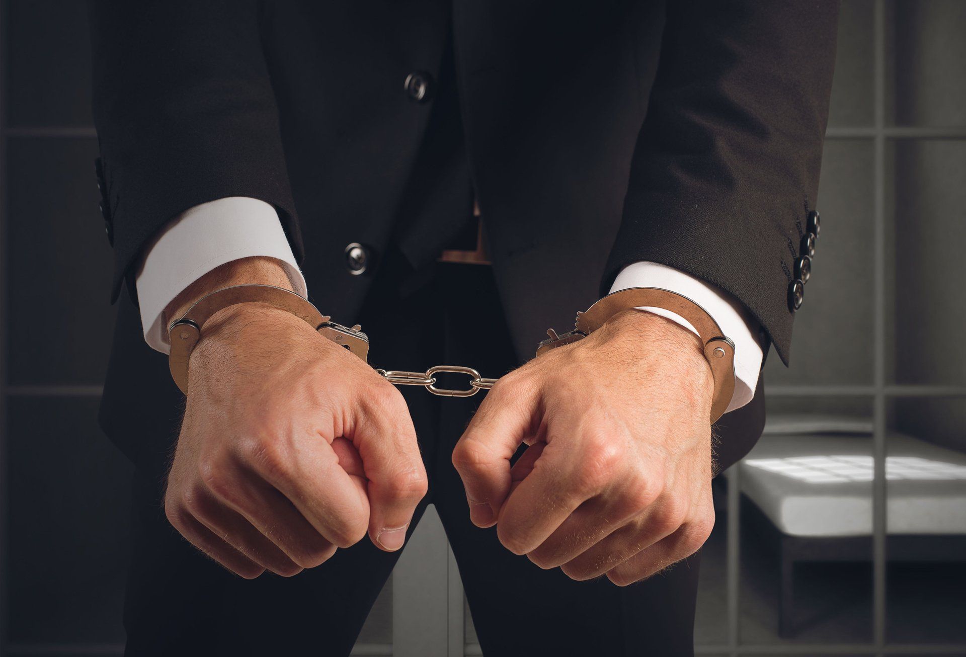 Businessman handcuffed