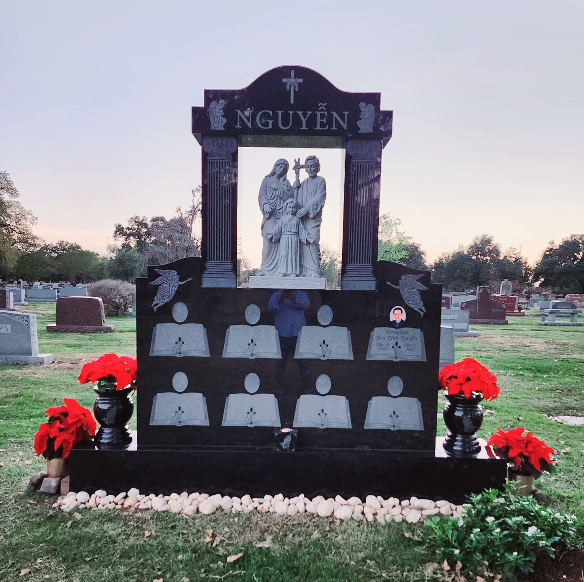 A gravestone for nguyen in a cemetery