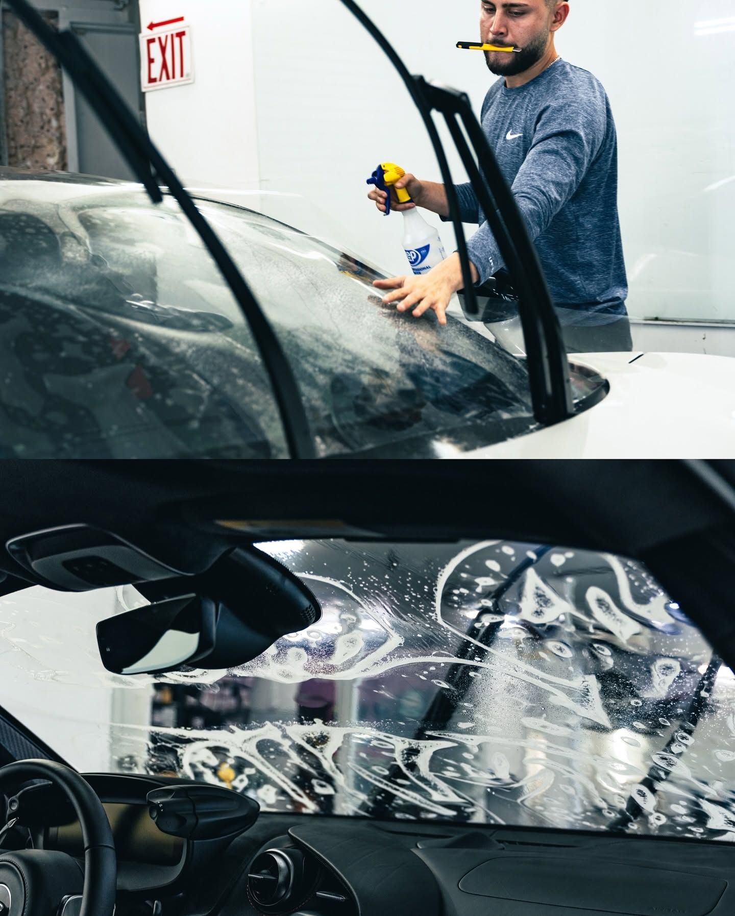Car windshield repair technician inspecting cracked glass with a tool in a garage