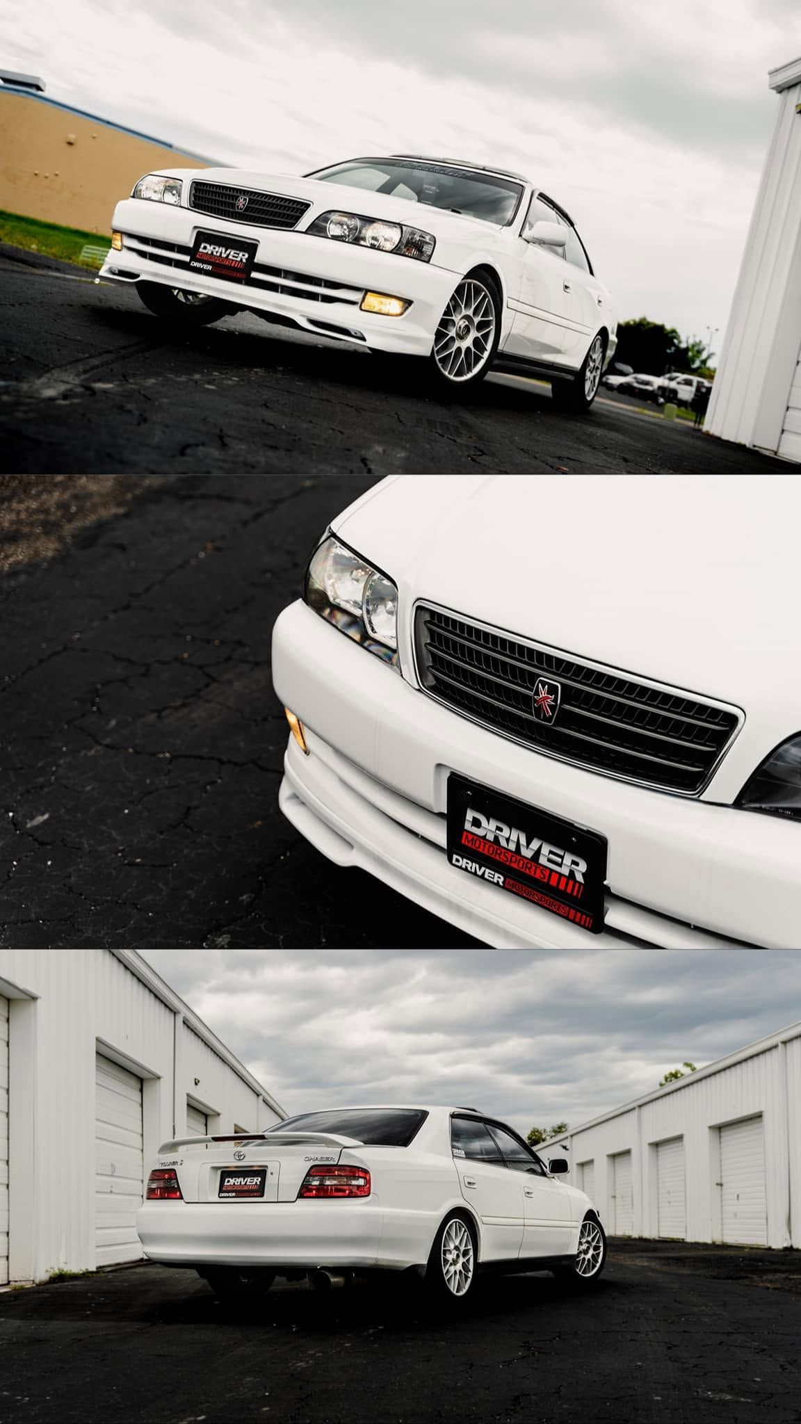 White sedan showcased in a car wash bay, with close-up front and rear angle shots and wet pavement.